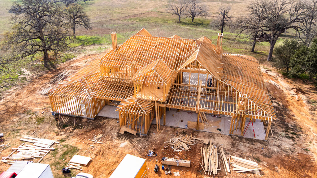 Custom home framing in progress in Greater Houston